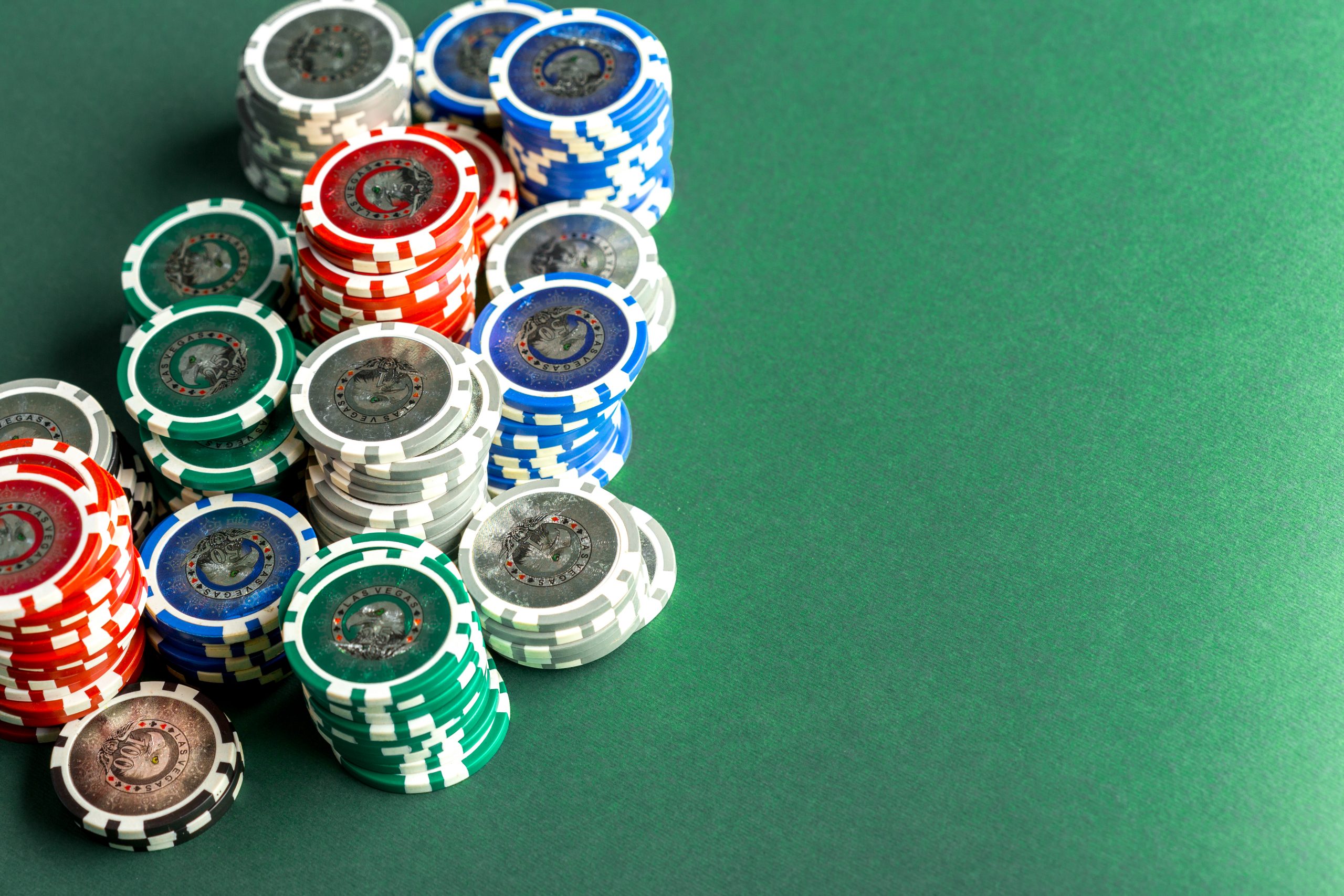 cards chips poker green table scaled